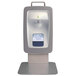 A white Kutol Health Guard countertop hand sanitizer dispenser on a stand.