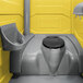A yellow PolyJohn portable restroom with a sink.