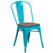 A teal-blue metal restaurant chair with a wood seat.