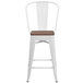 A white metal Flash Furniture counter height stool with a wooden seat.