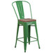 A Flash Furniture green metal restaurant bar stool with a wood seat.