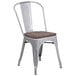 A Flash Furniture silver metal chair with a wood seat.
