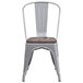 A Flash Furniture metal chair with a wood seat and back.