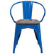 A blue Flash Furniture metal restaurant chair with a wood seat and vertical slat back.