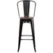 A Flash Furniture black metal bar stool with a wooden seat and back.