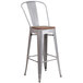A Flash Furniture silver metal bar stool with a wood seat and vertical slat back.