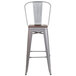 A Flash Furniture silver metal bar stool with a wooden seat and vertical slat back.