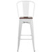 A white Flash Furniture bar stool with a wood seat and vertical slat back.