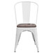 A white metal Flash Furniture restaurant chair with a wood seat and vertical slat back.