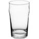 An Acopa English Pub glass filled with a clear liquid on a white background.