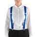 A woman wearing Henry Segal royal blue suspenders and a white shirt.
