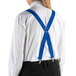 A person wearing Henry Segal royal blue clip-end suspenders over a white shirt.