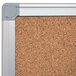 A MasterVision cork board with an aluminum frame and gray trim.