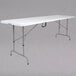 A white rectangular Flash Furniture folding table with a metal frame.
