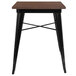 A Flash Furniture square standard height table with a walnut wood top and black metal legs.