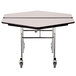 A white hexagonal cafeteria table with a black T-molding edge and wheels.