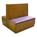 An American Tables & Seating wooden booth with purple cushions.