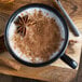 A mug of Oregon Chai Organic Spiced Chai Tea Latte with cinnamon and star anise.