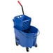 A Rubbermaid blue mop bucket with a side press wringer.