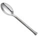 A Oneida Wyatt stainless steel spoon with a long silver handle.