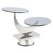 A table with two round glass tables on a Bon Chef stainless steel and glass display stand with a moon design.