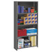 A Tennsco medium gray steel commercial shelving unit holding boxes and papers.
