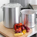 Choice 60 Qt. Standard Weight Aluminum Stock Pot with Steamer Basket and Cover Main Thumbnail 1