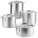 A group of aluminum Choice stock pots and covers.