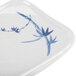 A white rectangular plate with blue painted bamboo leaves.
