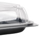A clear plastic Sabert catering tray with a high dome lid.