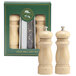 A Chef Specialties Salem natural wood pepper mill with a white lid and a green label next to a salt mill in a box.