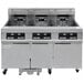 A Frymaster 3 unit electric floor fryer with digital controller and filtration system.