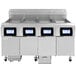 A large stainless steel Frymaster gas floor fryer with four drawers.