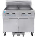 A Frymaster gas floor fryer with two drawers and two doors.