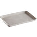 A white rectangular Huhtamaki Chinet molded fiber tray with a textured edge.