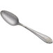 A Libbey stainless steel dessert spoon with a design on the handle.