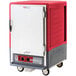 A red and grey rectangular Metro C5 heated holding cabinet with a door.