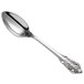 A Reserve by Libbey stainless steel demitasse spoon with an ornate handle.