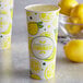 A close-up of a Carnival King Lemonade paper cup with lemons on the label.
