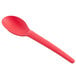 A red compostable plastic spoon with a coral design.