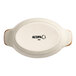 A small oval porcelain rarebit dish with handles, shown from the bottom and labeled 'Acopa'.