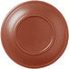 A close-up of a Libbey Driftstone clay saucer with a circular rim in brown.