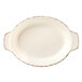 A white oval dish with brown trim.