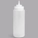 A white plastic Tablecraft squeeze bottle with a white and pointy tip.