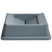 A grey Rubbermaid Untouchable trash can lid with a rectangular hole in the middle.