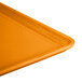 A close up of a Cambro citrus orange dietary tray.