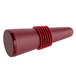 A close-up of a red wine bottle stopper with a red plastic knob.