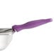 A Vollrath Jacob's Pride purple round portion spoon with a metal scoop and purple handle.