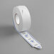 A roll of white paper with blue labels.