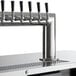 A Beverage-Air black beer dispenser with 12 silver metal beer taps.